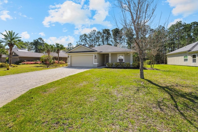 ranch-style house featuring stucco siding, a front lawn, decorative driveway, and a garage