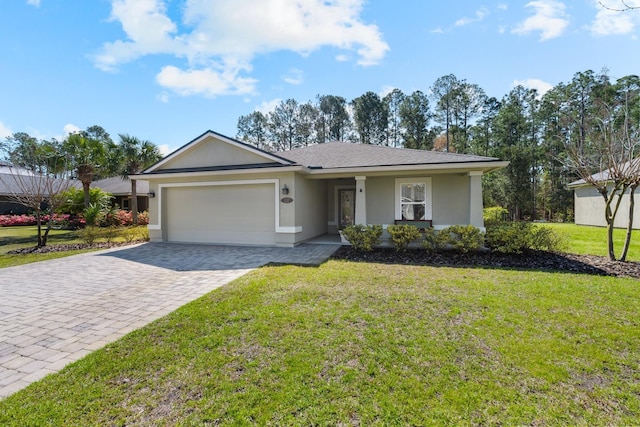 ranch-style house with decorative driveway, a front lawn, an attached garage, and stucco siding