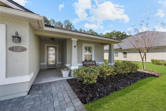 137 Cereus Ln, Saint Augustine, FL 32086 - entrance to property featuring stucco siding and a yard