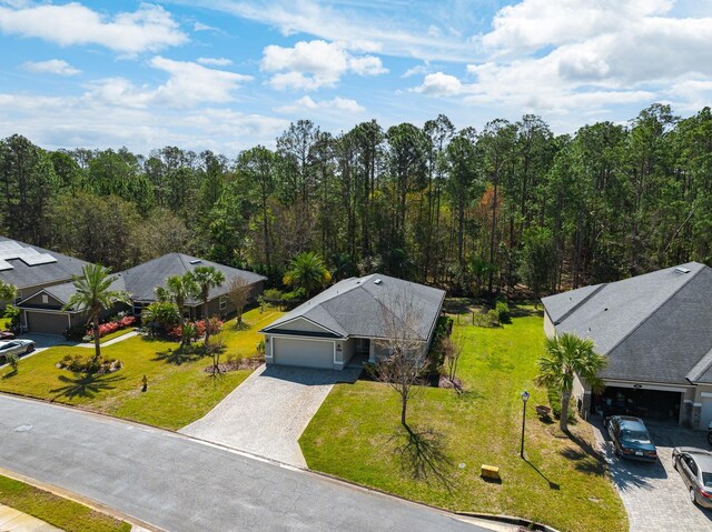 aerial view featuring a wooded view