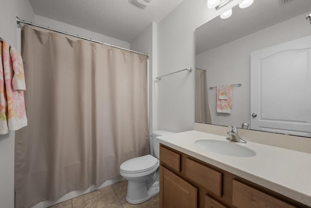 bathroom featuring vanity, tile patterned flooring, shower / bath combination with curtain, a textured ceiling, and toilet