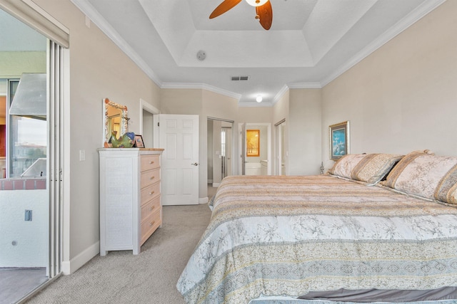 bedroom with light colored carpet, a raised ceiling, ceiling fan, and crown molding