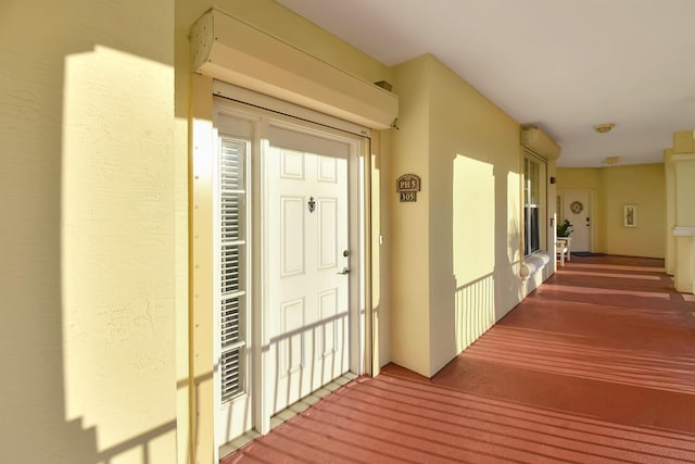 doorway to property featuring covered porch