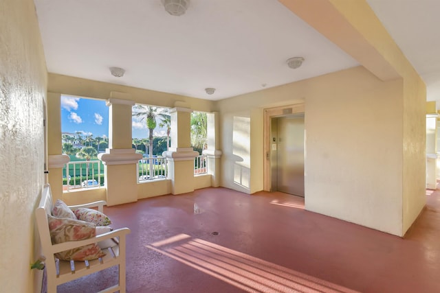 sunroom / solarium featuring elevator