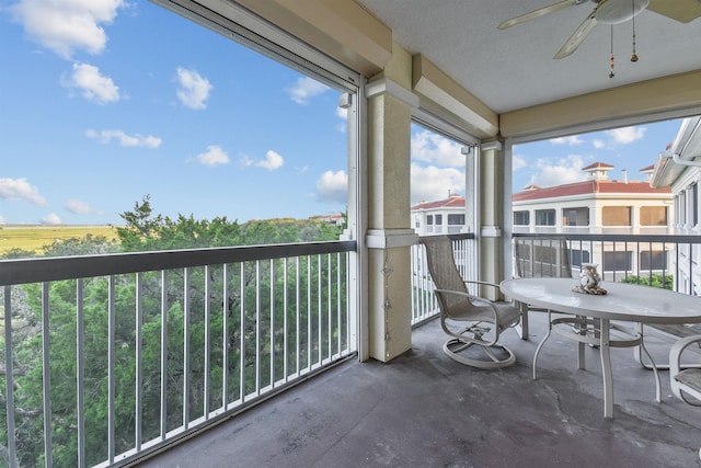 balcony featuring ceiling fan