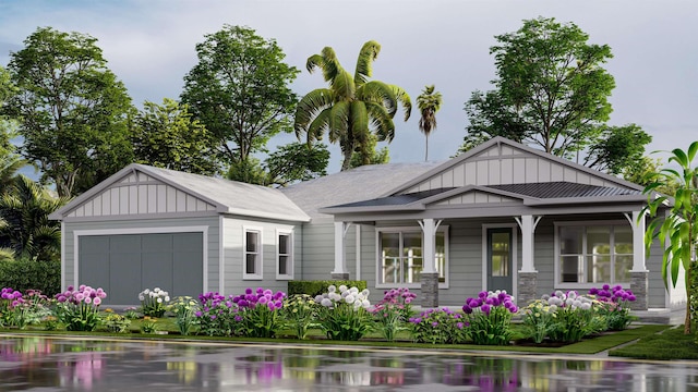 view of front of home with a garage and covered porch