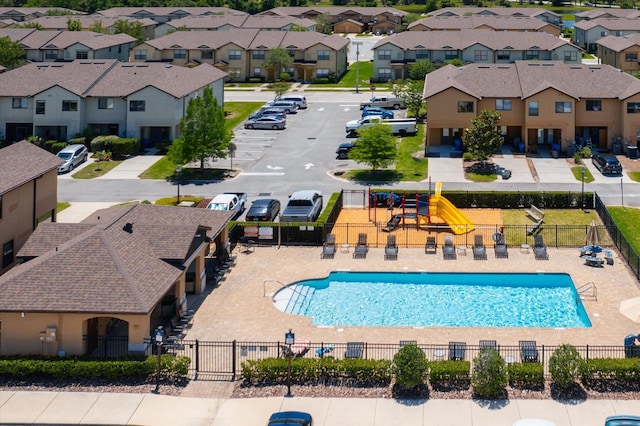 view of pool featuring a playground