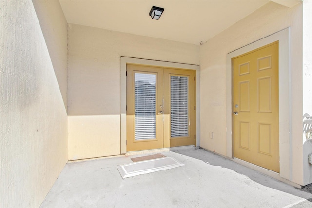 property entrance featuring french doors