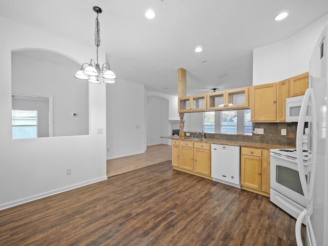 kitchen featuring white appliances, glass insert cabinets, decorative light fixtures, a healthy amount of sunlight, and light brown cabinets