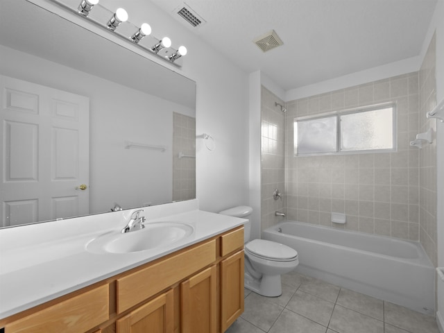 full bathroom featuring visible vents, toilet, tile patterned floors, tub / shower combination, and vanity