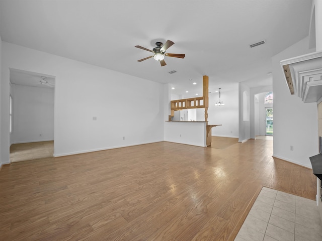 unfurnished living room featuring light wood finished floors, baseboards, visible vents, a ceiling fan, and recessed lighting