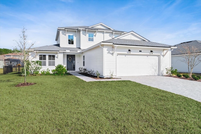 view of front of home with a garage and a front yard