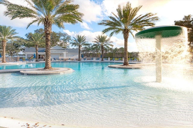 view of pool with pool water feature