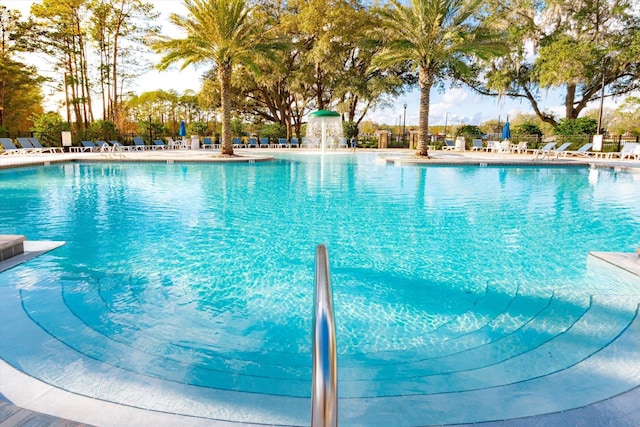 view of pool with pool water feature