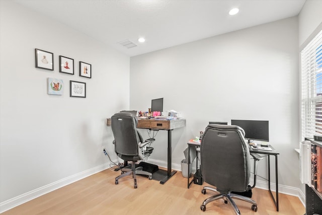 office with light hardwood / wood-style flooring