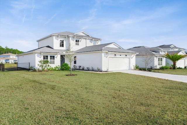 view of front of property with a garage and a front lawn