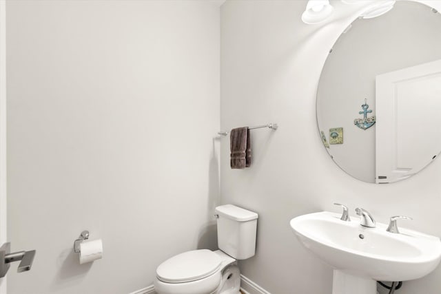 bathroom featuring sink and toilet