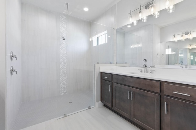 bathroom with vanity, tile patterned flooring, and walk in shower