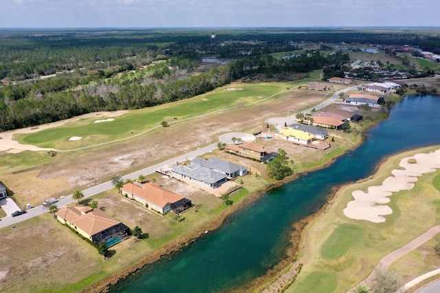 aerial view featuring a water view, view of golf course, and a residential view