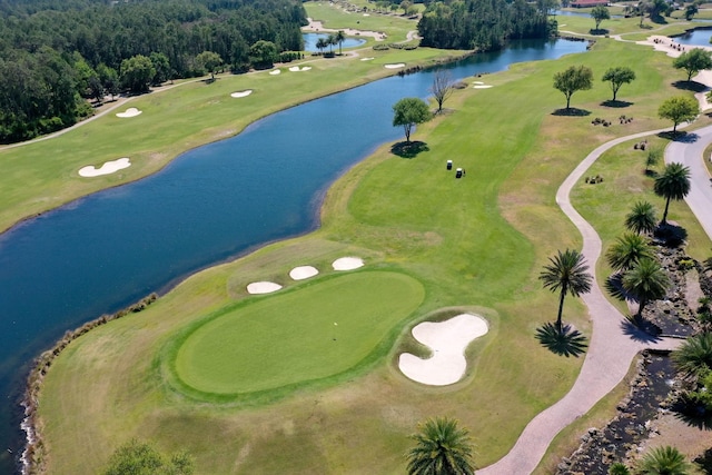 bird's eye view with view of golf course and a water view
