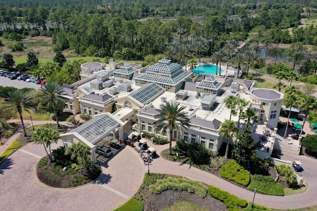 birds eye view of property with a wooded view