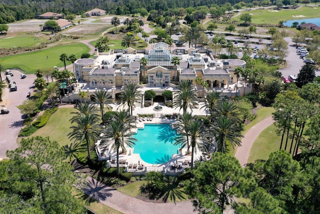 aerial view featuring golf course view and a water view