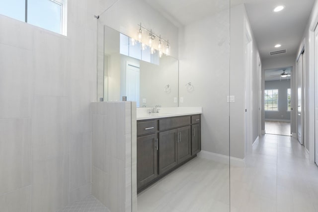 bathroom with visible vents, a ceiling fan, a walk in shower, recessed lighting, and vanity