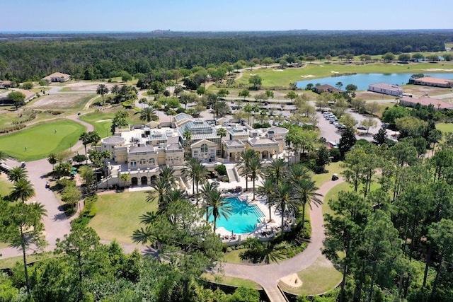aerial view featuring a water view, golf course view, and a wooded view