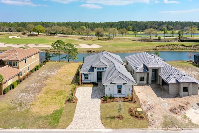 birds eye view of property featuring a water view and golf course view