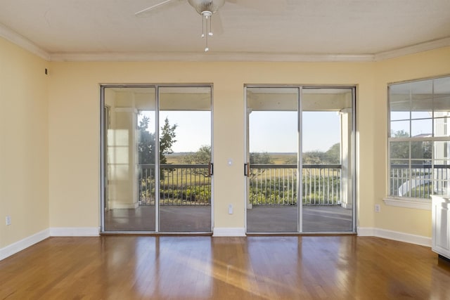 doorway to outside with ceiling fan, ornamental molding, and hardwood / wood-style flooring