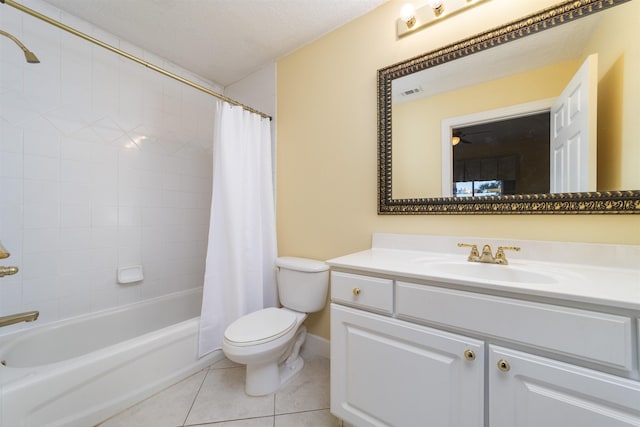 full bathroom featuring shower / bath combo, vanity, tile patterned floors, toilet, and a textured ceiling