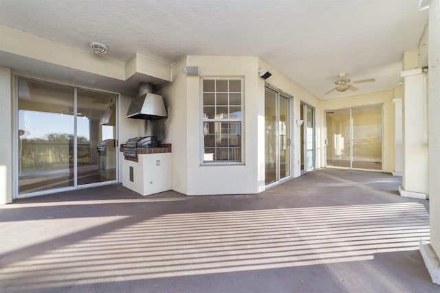 interior space featuring ceiling fan