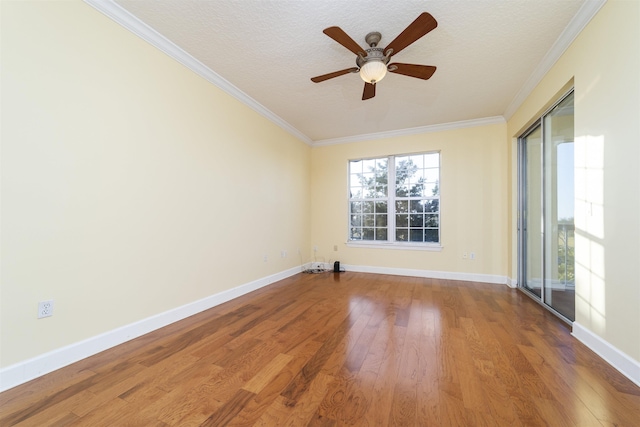 unfurnished room with crown molding, hardwood / wood-style floors, and a textured ceiling