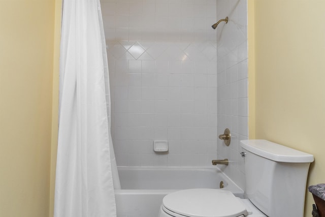 bathroom with toilet and shower / tub combo with curtain