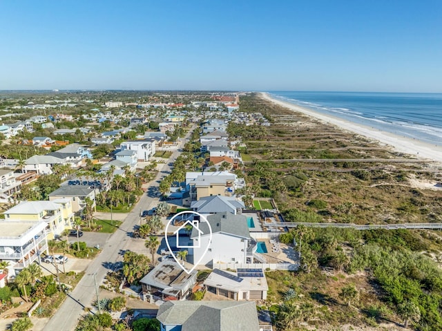 bird's eye view featuring a beach view and a water view