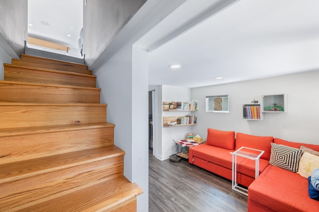 stairway with recessed lighting and wood finished floors