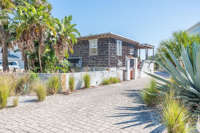 exterior space with decorative driveway