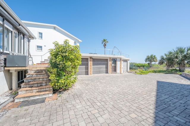 exterior space with decorative driveway