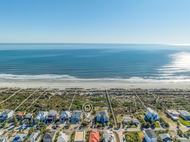 aerial view featuring a residential view, a water view, and a view of the beach