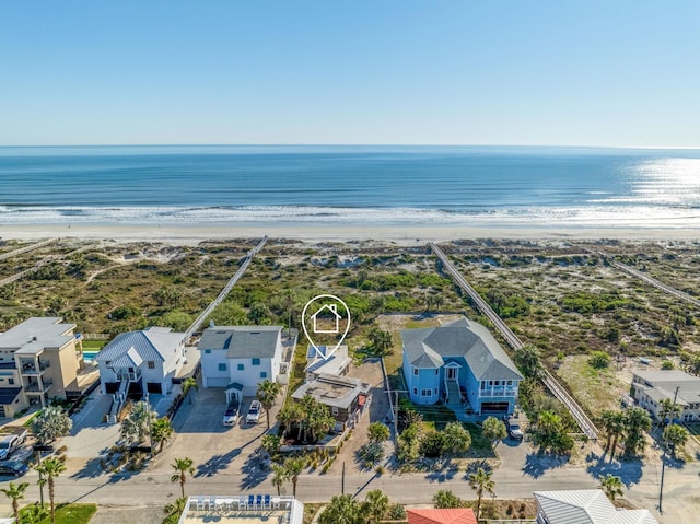 bird's eye view featuring a view of the beach and a water view