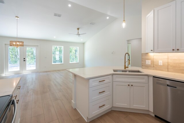 411 Royal Rd, Saint Augustine, FL 32086 - kitchen featuring dishwasher, visible vents, a sink, white cabinetry, and a peninsula