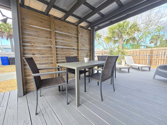 deck with fence and outdoor dining area