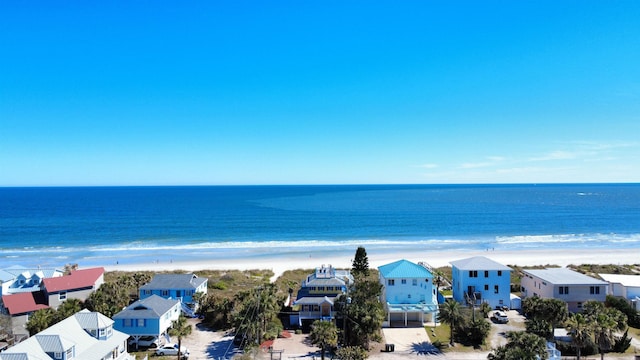 view of water feature featuring a view of the beach and a residential view