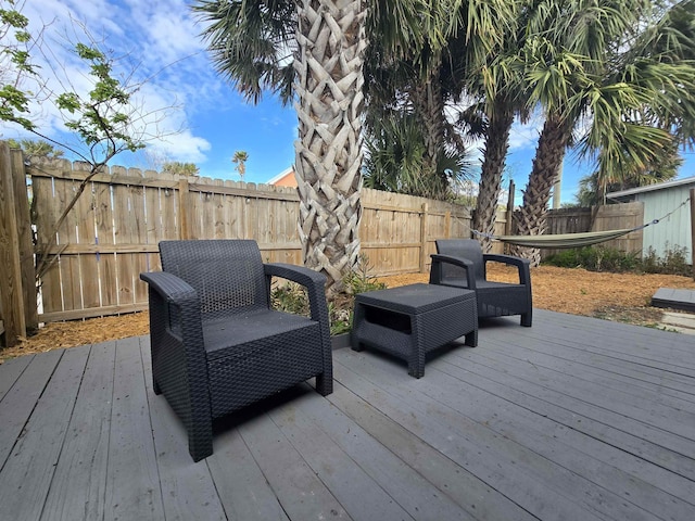 deck with a fenced backyard