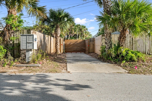 view of gate featuring fence