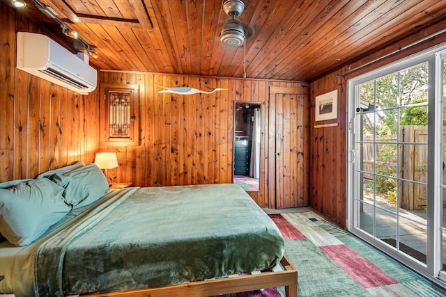 bedroom with an AC wall unit, wooden walls, wood ceiling, and access to exterior