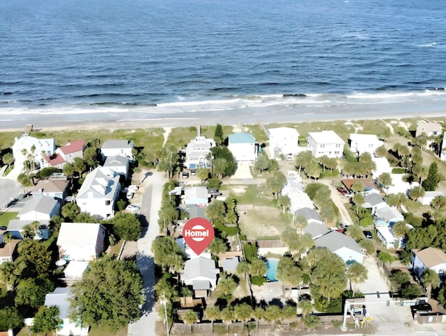 drone / aerial view featuring a view of the beach and a water view