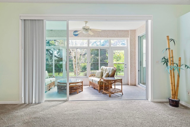 sunroom featuring ceiling fan