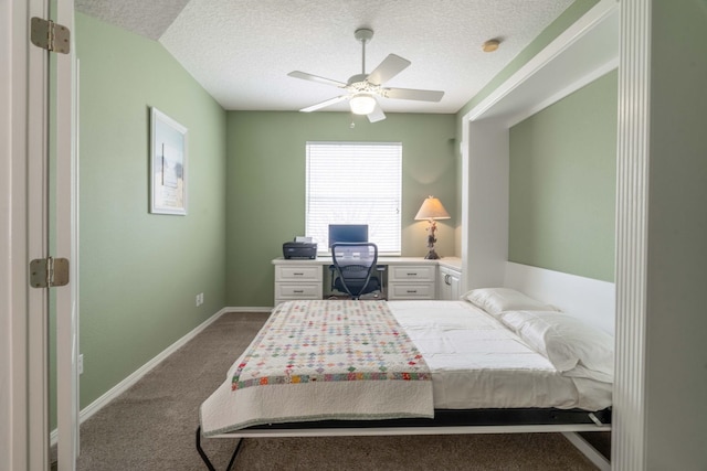 carpeted bedroom with a ceiling fan, baseboards, and a textured ceiling