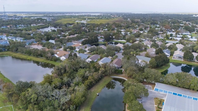 bird's eye view with a water view and a residential view